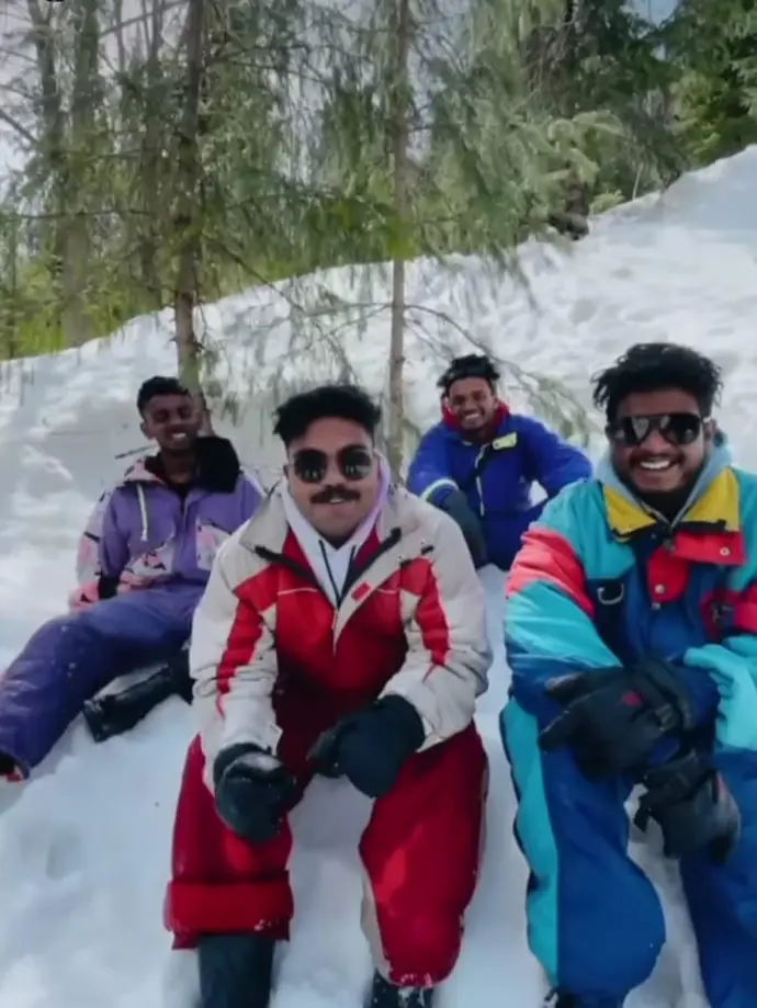 Four friends enjoying a peaceful moment with the majestic snow